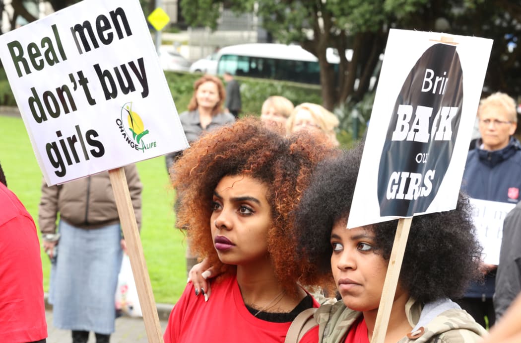 Two protesters outside Parliament