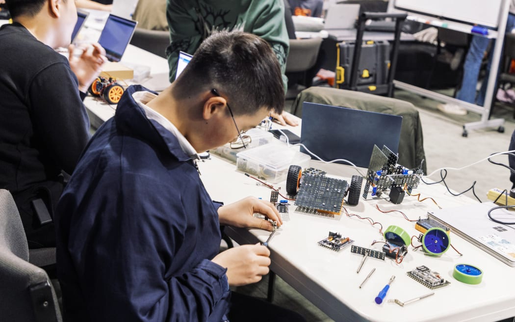 Young students learn technology, science, and engineering through fun and hands-on experiences by building a robot.