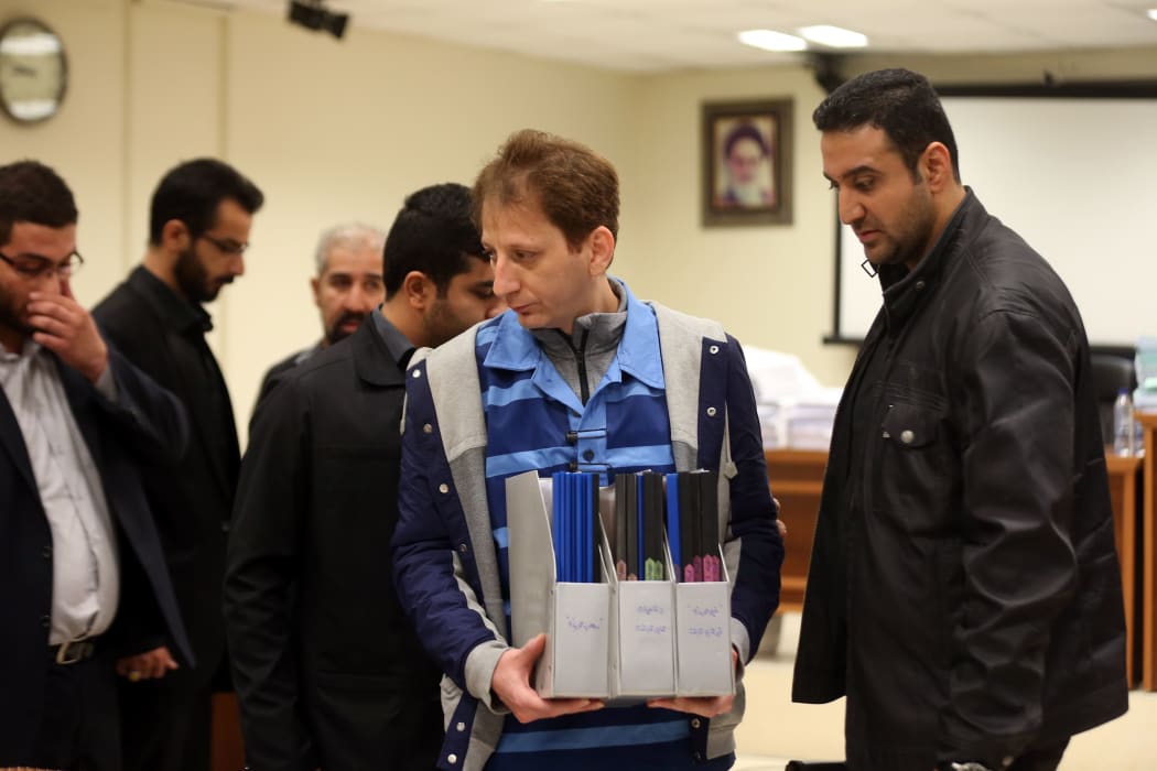 Iranian billionaire tycoon Babak Zanjani, centre, in a court in Tehran, Iran.