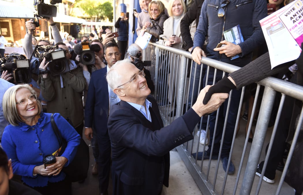 Malcolm Turnbull and his wife Lucy leave a polling station after casting their vote in Sydney.