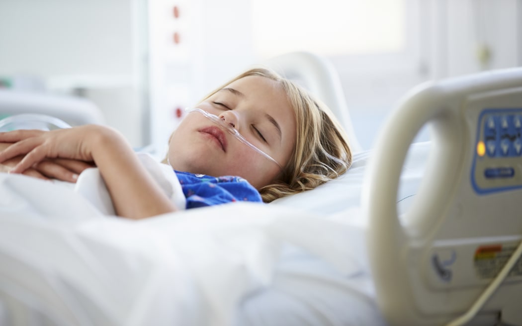 Child in hospital bed
