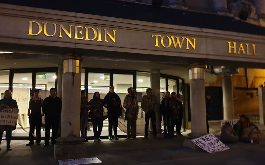 Protesters outside the NZ Minerals Forum in Dunedin.