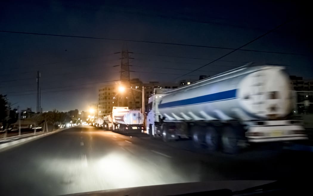 Numerous water tankers commute in Tehran amid the third day of Israel's waves of strikes against Iran, on Sunday, June 15, 2025. (Photo by Khoshiran / Middle East Images via AFP)