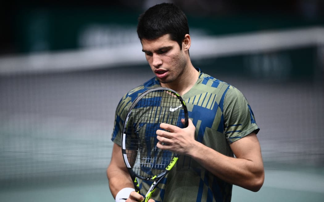 Spain's Carlos Alcaraz Garfia reacts during the men's singles quarter-final tennis match between Spain's Carlos Alcaraz Garfia and Denmark's Holger Rune on day 5 of the ATP World Tour Masters 1000 - Paris Masters (Paris Bercy) - indoor tennis tournament at The AccorHotels Arena in Paris on November 4, 2022. (Photo by Christophe ARCHAMBAULT / AFP)