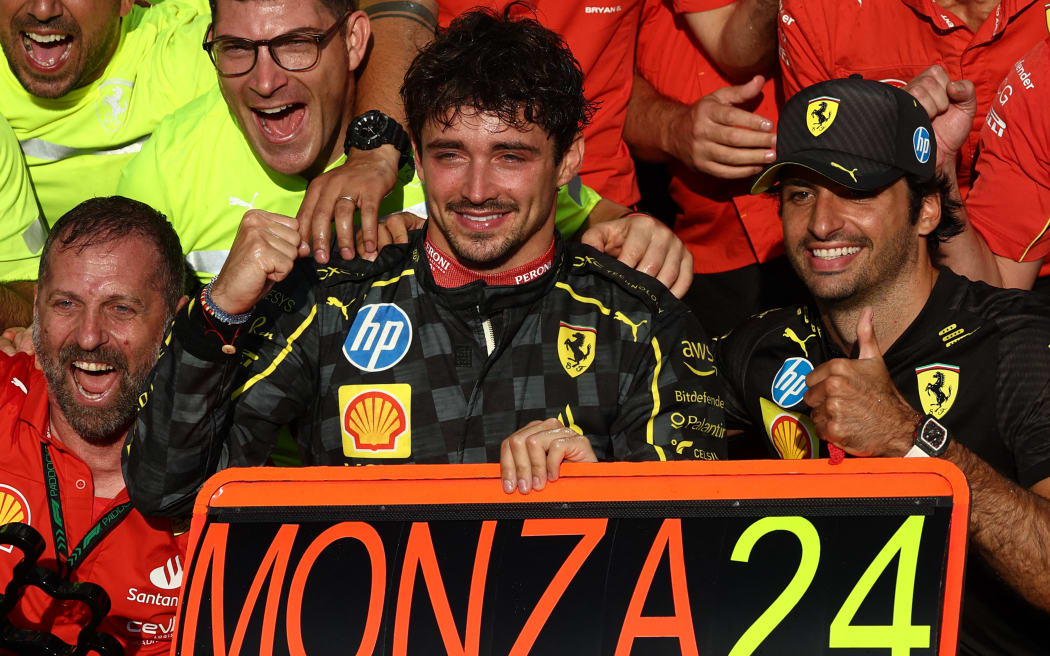 Charles Leclerc and Carlos Sainz of Ferrari celebrate with the team after the Formula 1 Italian Grand Prix at Autodromo Nazionale di Monza in Monza, Italy on September 1, 2024.