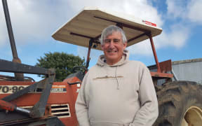 Farmer in front of his tractor