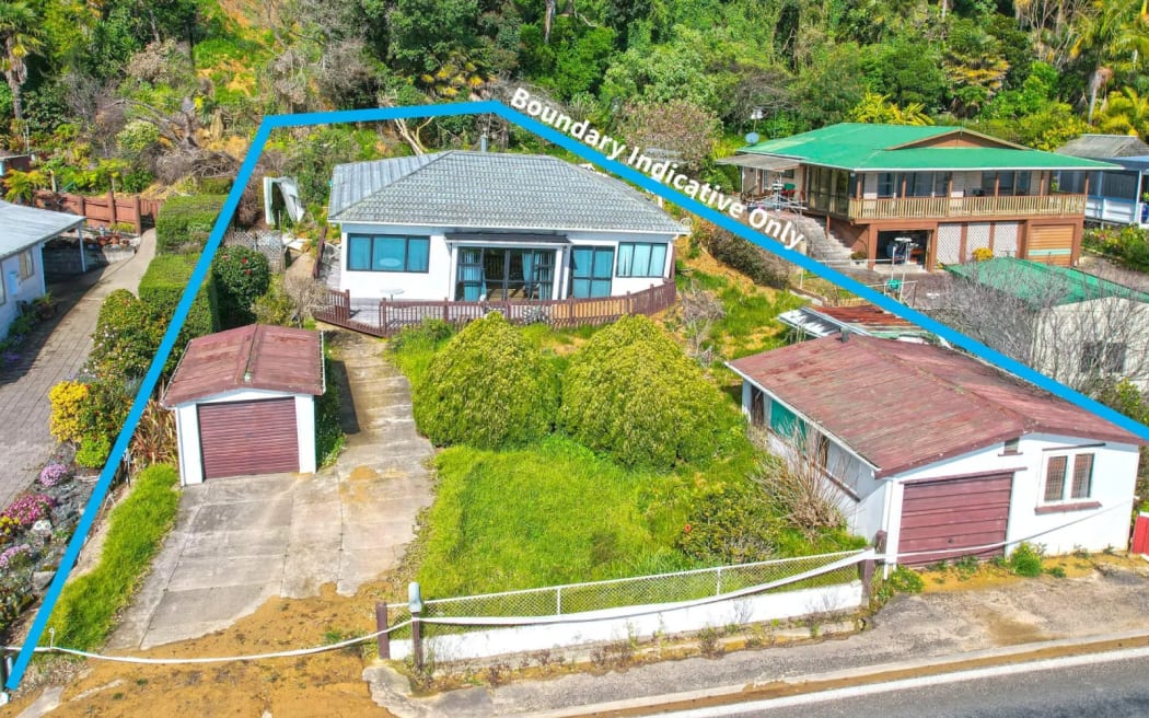 A house hit by a landslide in Coromandel region