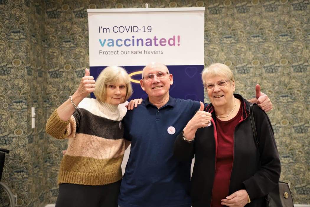 Residents Ellen Lund and Don and Ann Gibbon after getting their dose.