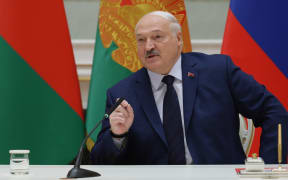 In this pool photograph distributed by the Russian state agency Sputnik, Belarus' President Alexander Lukashenko attends a signing ceremony with Russia's President during a meeting of the Supreme State Council of the Union State of Russia and Belarus, at the presidential palace in Minsk on December 6, 2024.