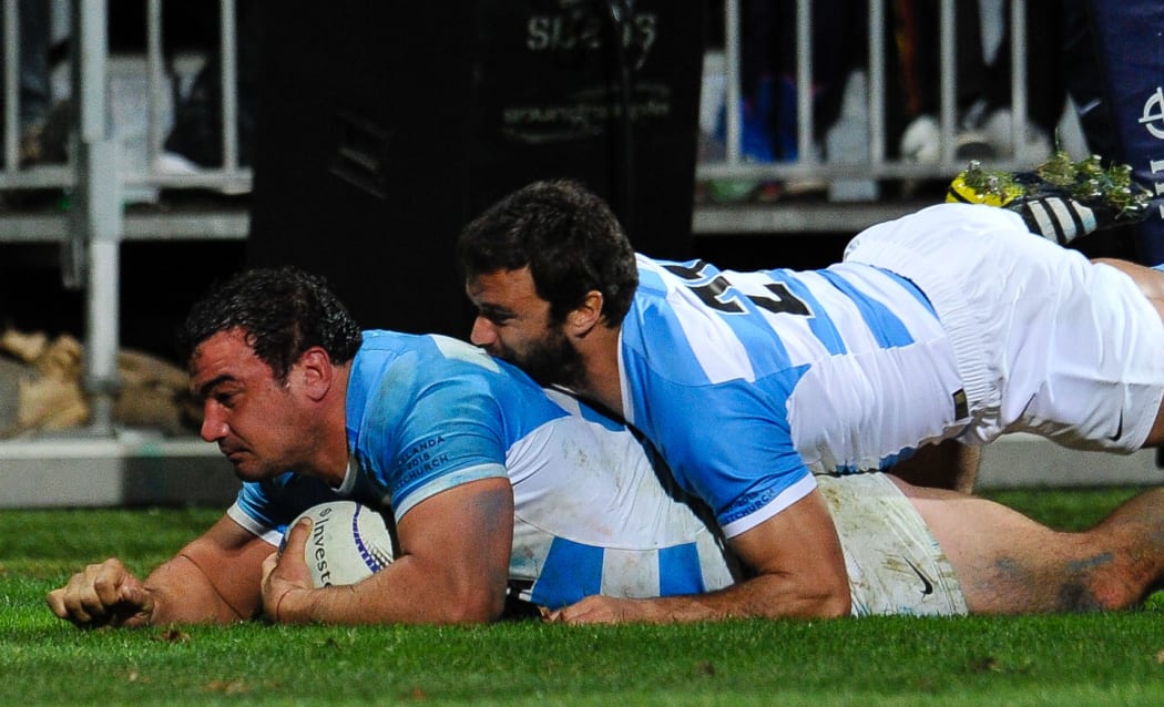 Agustin Creevy of Argentina scores a try against the All Blacks from a rolling maul with help from Martin Landajo, July, 2015.