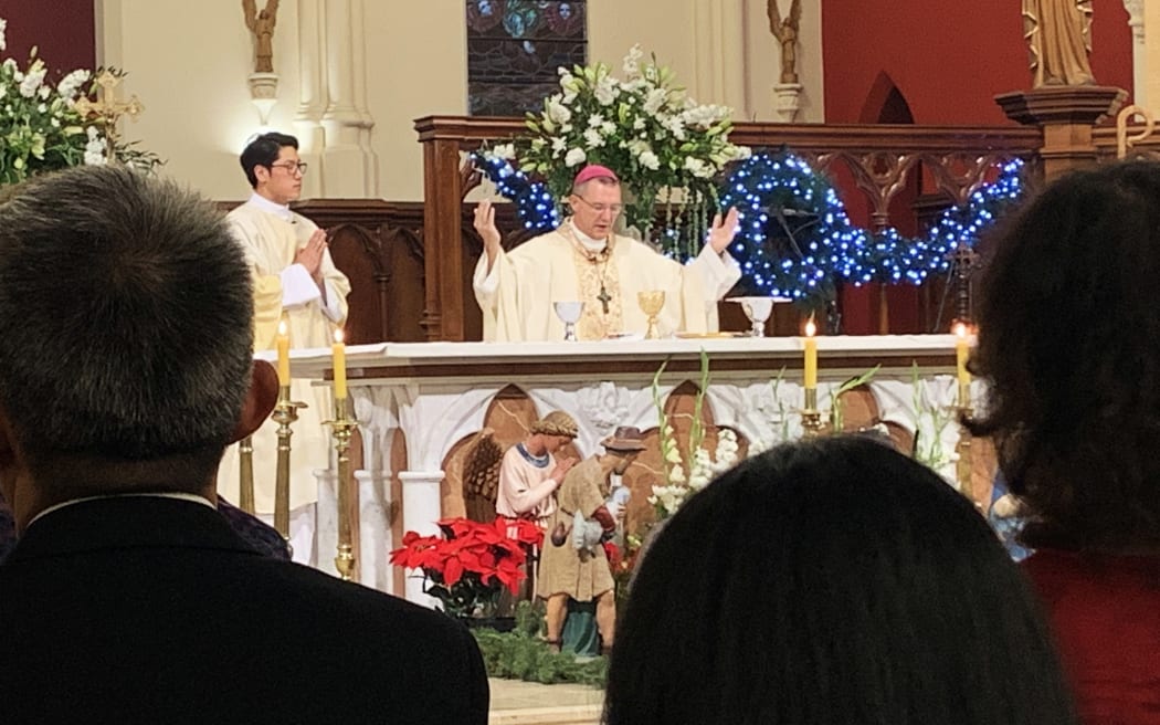 Bishop Gielen consecrates the bread and wine