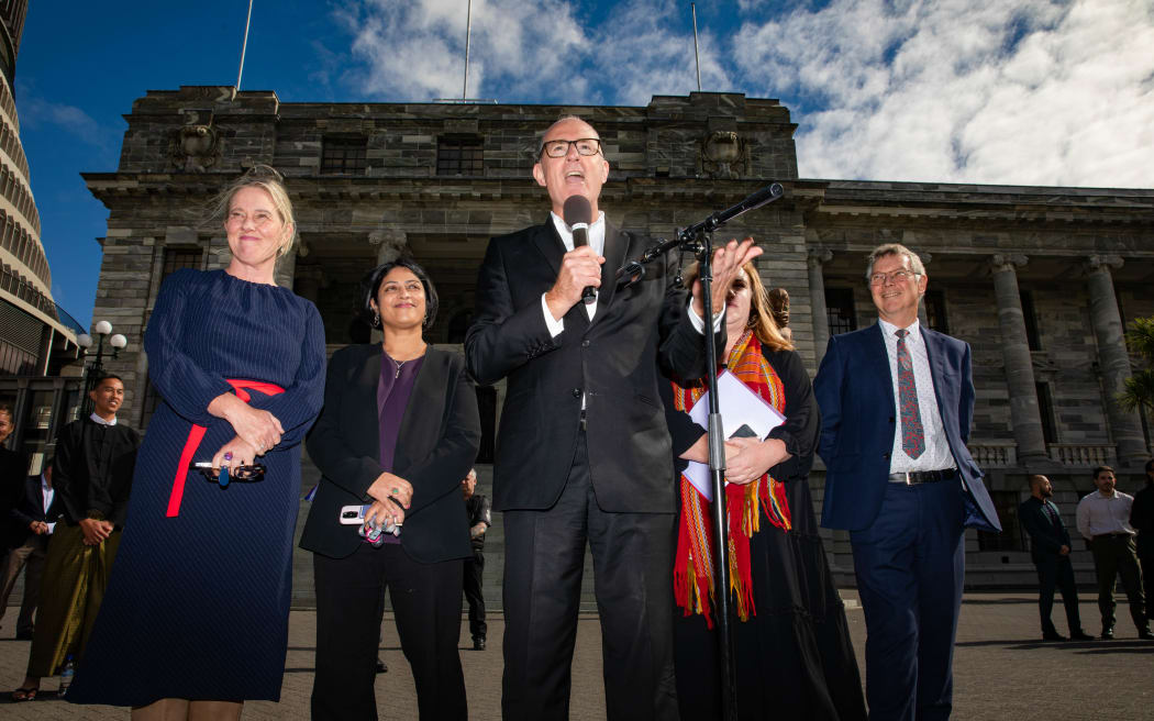 From left, Labour party members Helen White, Priyanca Radhakrishnan, Phil Twyford, Rachel Boyack, and David Parker address protesters from the Myanmar community who marched to Parliament on 9 April, 2024.