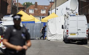 Police officers guard a cordon in Salisbury, one of five locations in the city and Amesbury under investigation.
