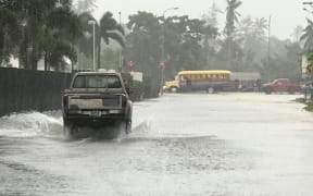 A flooded road in Samoa's Pesega.