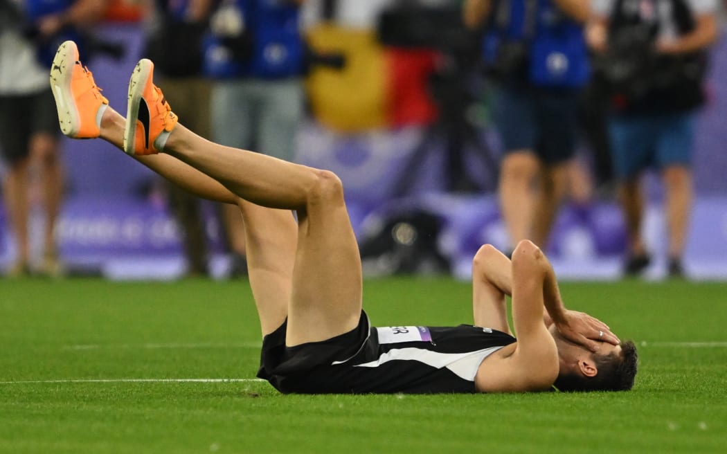 Gold medalist New Zealand high jumper Hamish Kerr reacts after winning an Olympic gold medal in Paris, 2024.