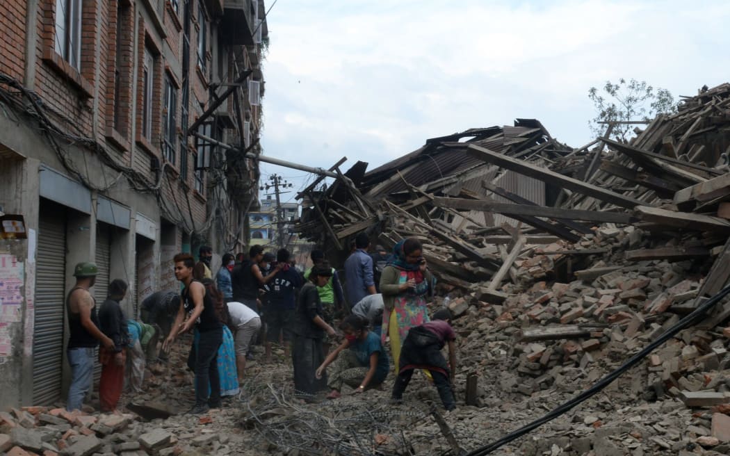 Rescuers in places used their bare hands to dig for survivors still buried underneath the rubble.