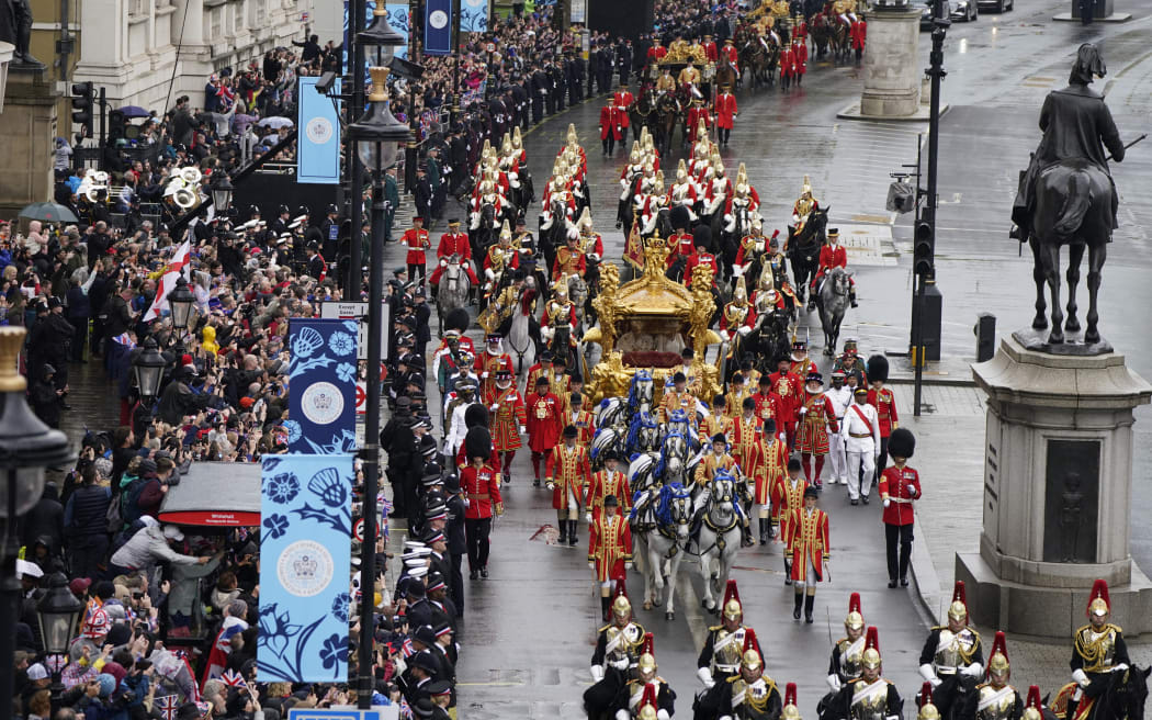 Britain's King Charles III and Britain's Queen Camilla travel in the Gold State Coach, built in 1762, back to Buckingham Palace from Westminster Abbey in central London on May 6, 2023, after their coronations. - The set-piece coronation is the first in Britain in 70 years, and only the second in history to be televised. Charles will be the 40th reigning monarch to be crowned at the central London church since King William I in 1066. Outside the UK, he is also king of 14 other Commonwealth countries, including Australia, Canada and New Zealand. Camilla, his second wife, was crowned alongside him and will now be known as Queen Camilla. (Photo by Danny Lawson / POOL / AFP)