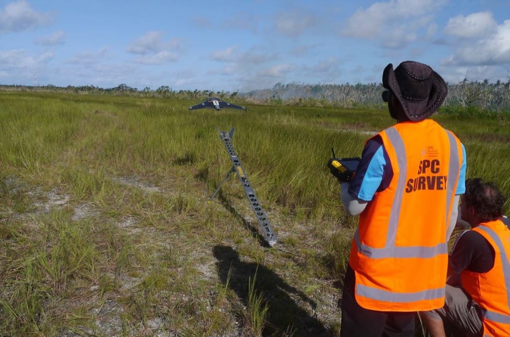 A drone taking off to assess damage in Vanuatu after Cyclone Pam