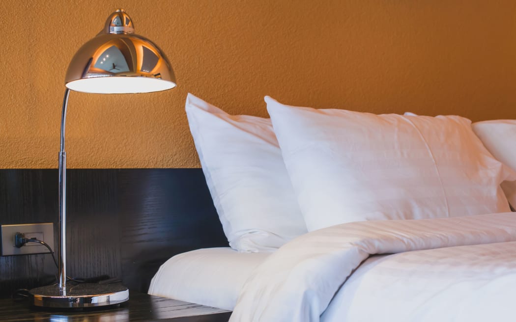 hotel room abstract interior, lamp near the bed