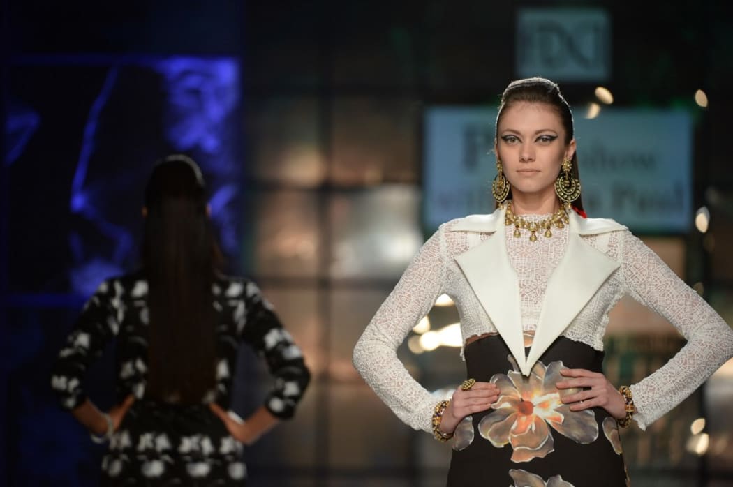 A model presents a creation by Indian designer Satya Paul during the PCJ Delhi Couture Week 2013 in New Delhi on August 2, 2013.