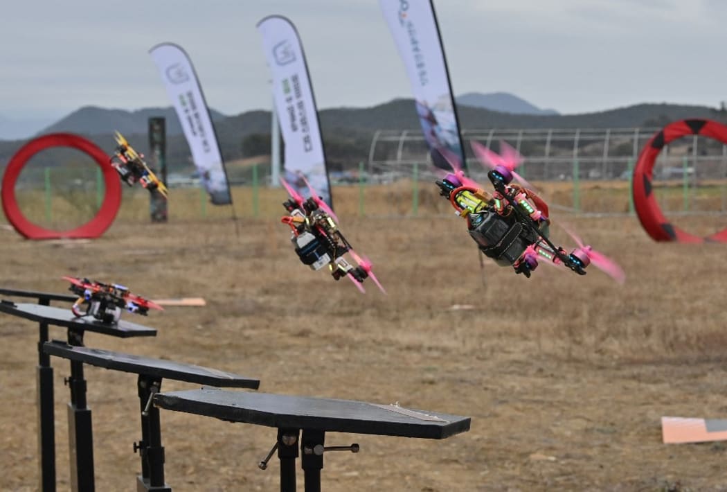 Drones taking flight during a drone-racing league round in the southern county of Hadong.