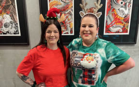 Jessica Moore (right) pictured with her tattoo artist Ebony Mellowship (left).