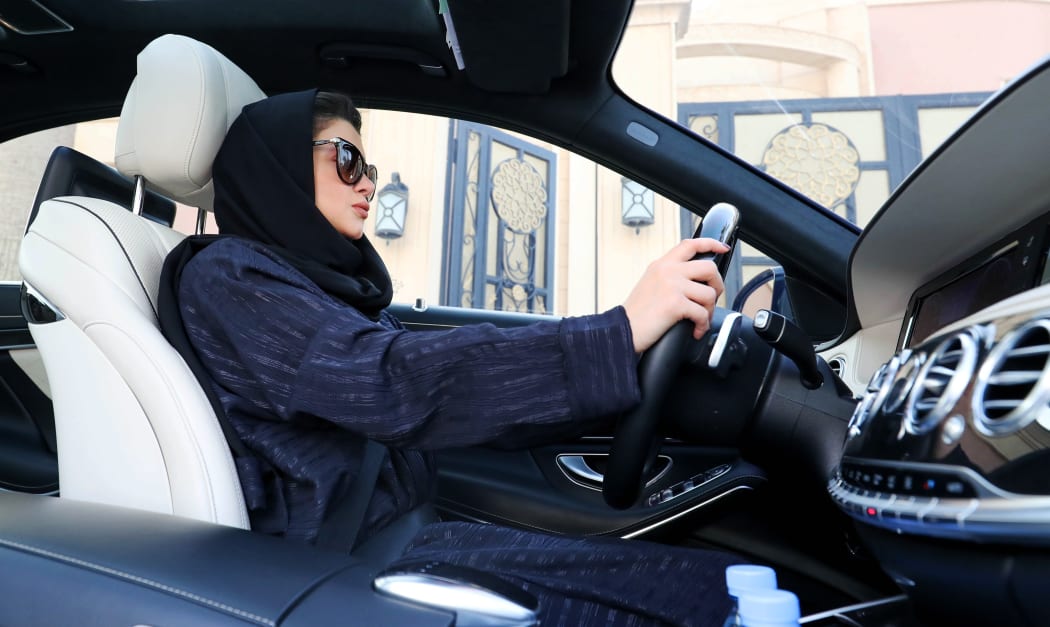 A Saudi woman practices driving in Riyadh, on April 29, 2018, ahead of the lifting of a ban on women driving in Saudi Arabia in the summer.
