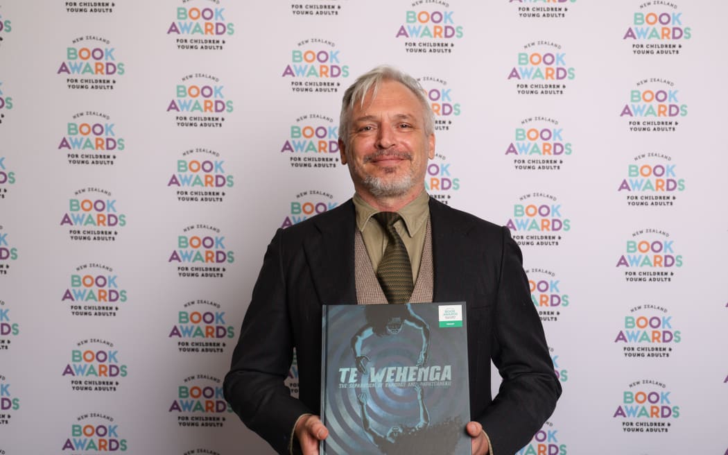 Motueka writer Mat Tait with his book Te Wehenga: The Separation of Ranginui and Papatūānuku.