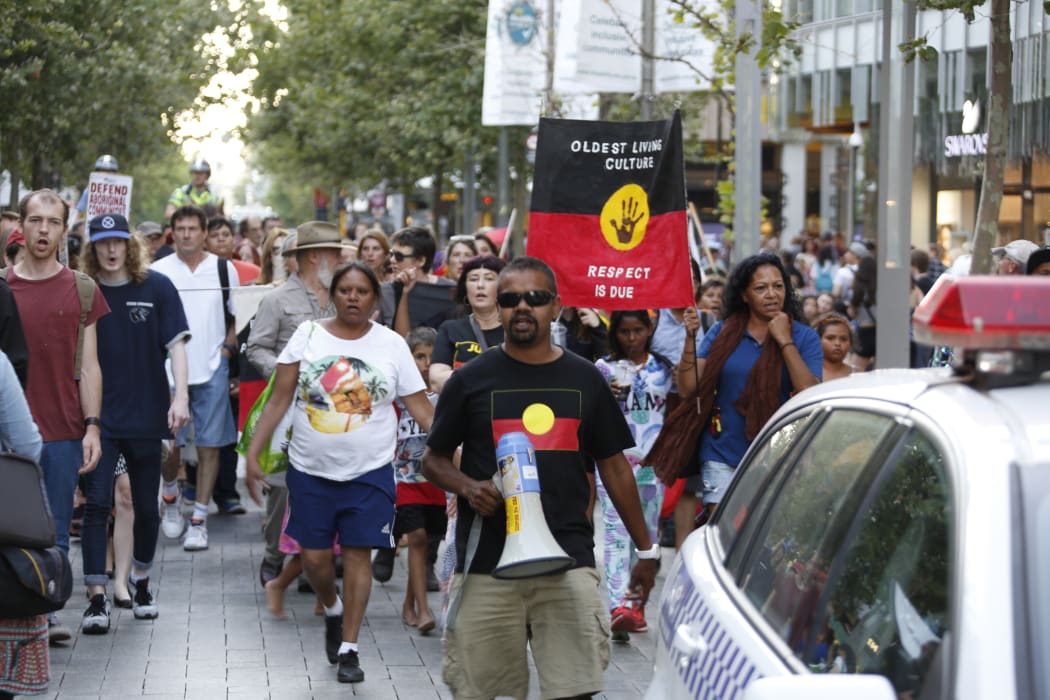 Marchers in Perth supporting a global call to action to stop the closure of closure of remote Aboriginal communities, November 2015.