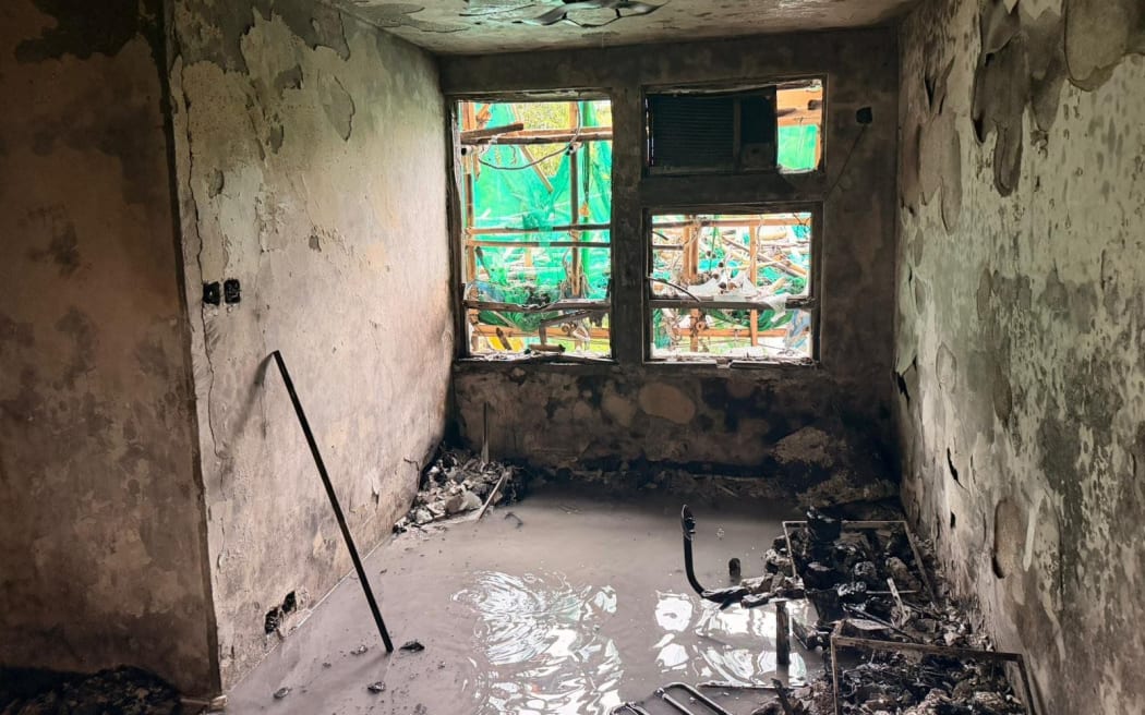 Hong Kong Police photos show the inside of burnt out apartments in Wang Fuk Court complex on Sunday November 30.