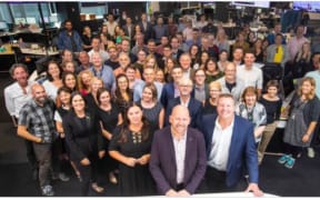 A promotional image from NZME showing editorial staff at the Herald
