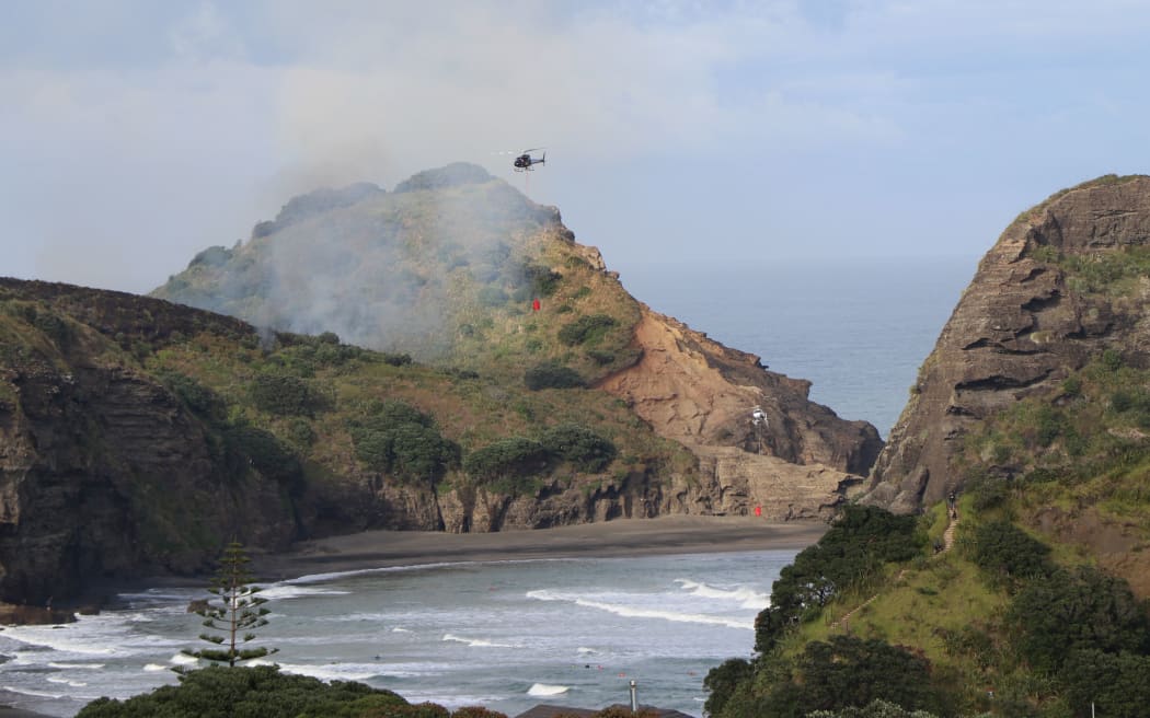 Two helicopters with monsoon buckets are being used to help bring the fire under control.