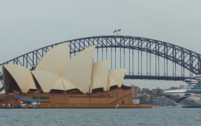 The Australian and Aboriginal flags fly at half-mast on the Harbour Bridge in Sydney on September 9, 2022 after Queen Elizabeth II, the longest-serving monarch in British history and an icon instantly recognisable to billions of people around the world, died at her Scottish Highland retreat on September 8 at the age of 96. (
