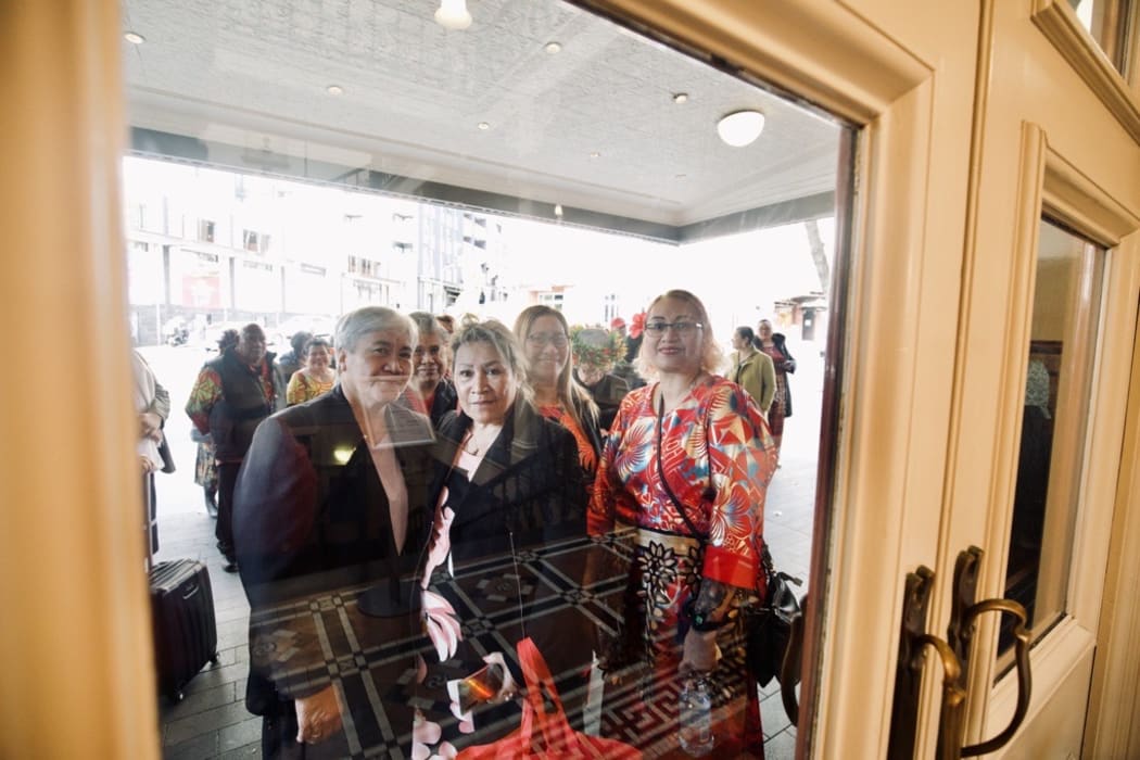 Tala Taiamoni and her friends and family wait for 2 pm to go inside Auckland Town Hall.