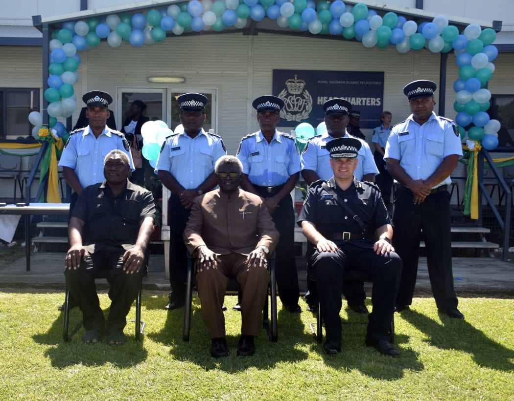 The five new RSIPF Officers  (standing) being deployed on the UN Peacekeeping Mission to Sudan with the Prime Minister, Hon. Manasseh Sogavare (sitting centre), Minister of Police, National Security and Correctional Services, Hon. Moses Garu (sitting left) and the Commissioner, Matthew Varley.