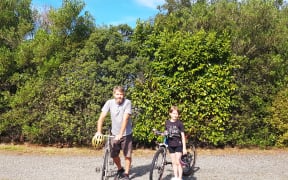Josh Barraud and his daughter on a bike ride in Wairarapa