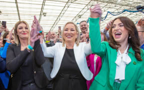 Sinn Fein party MLA member Michelle O'Neill (centre) celebrates with party members after being elected on the first count to the Northern Ireland Assembly.