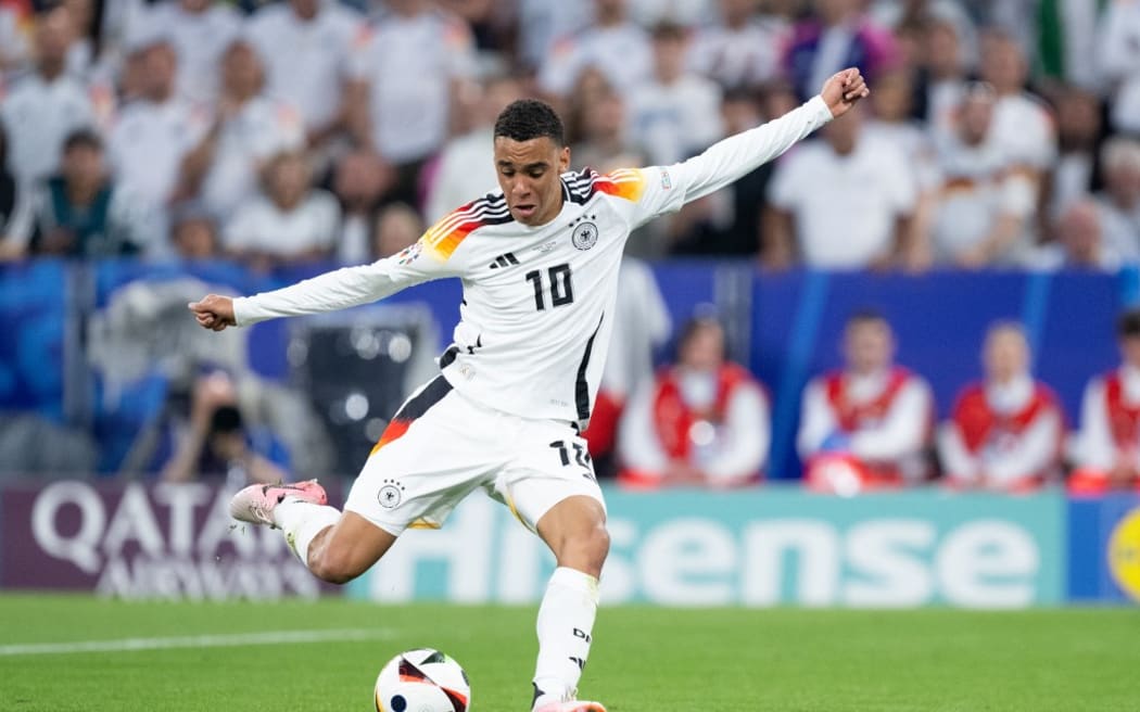 14 June 2024, Bavaria, Munich: Soccer: UEFA Euro 2024, European Championship, Germany - Scotland, Preliminary round, Group A, Matchday 1, Munich Football Arena, Germany's Jamal Musiala scores to make it 2-0. Photo: Sven Hoppe/dpa (Photo by SVEN HOPPE / DPA / dpa Picture-Alliance via AFP)