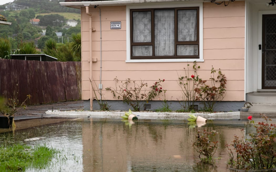 The home of Kannan Thiru was surrounded by a large pool of water still on Wednesday afternoon.