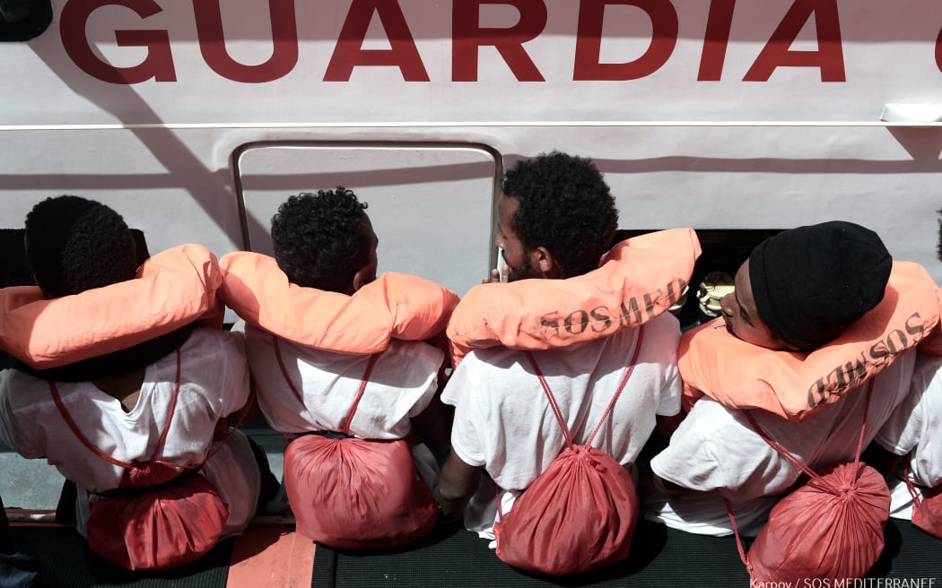 Migrants onboard a ship after being rescued in 2018.