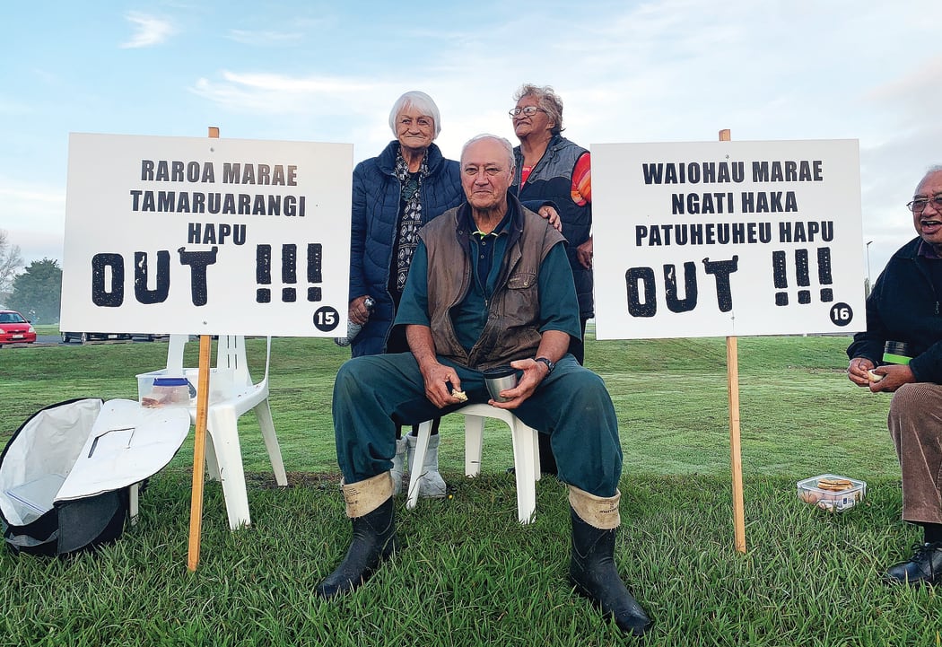 Tūhoe elders (L-R) Te Waiarani Harawira, Paki Nikora and Heni Davis-Teepa are flanked by the names of marae and hapū which have pulled out of Tūhoe governing body Te Uru Taumatua. They said these hapū and marae are now no longer able to access resources and have no voting rights.