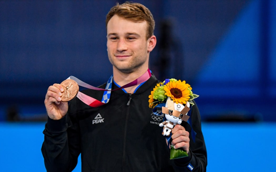 Dylan Schmidt with his bronze medal at Tokyo 2020 Olympic Games Trampoline Gymnastics at the Ariake Gymnastics Centre. Tokyo, Japan, Saturday 31 July 2021.