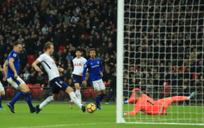 Tottenham Hotspur striker Harry Kane scores against Everton.