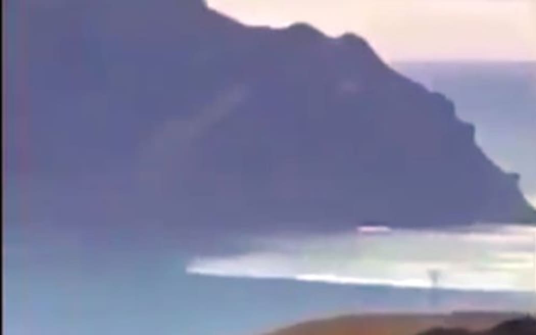 A tsunami surge rolling into Tokomaru Bay.