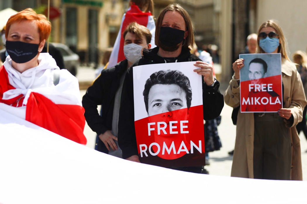 People demonstrate walking in the March of Solidarity with Belarus as part of the Global Solidarity Picket. Krakow, Poland on May 29, 2021