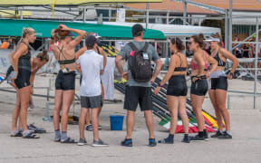Coach Dan Kelly talks to his rowers.