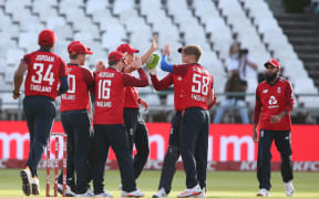 Jos Buttler of England and Sam Curran of England are congratulated, South Africa T20 series 2020.
