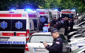 Ambulances and police officers arrive following a shooting at a school in the capital Belgrade on May 3, 2023. - Serbian police arrested a student following a shooting at an elementary school in the capital Belgrade on May 3, 2023, the interior ministry said. The shooting occurred at 8:40 am local time (06:40 GMT) at an elementary school in Belgrade's downtown Vracar district.