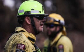 170224 CHRIS SKELTON / POOL
Firefighters continue their efforts on Saturday as they work to dampen down remaining hot spots and create a buffer zone around the 24km perimeter fire ground in Christchurch's Port Hills. Pictured Stephen Robson (Peel Forest Volunteer firefighter)