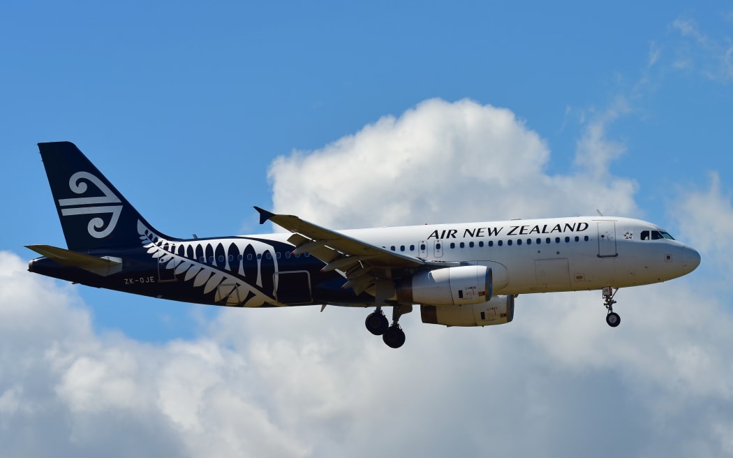 Air New Zealand Airbus A320 landing at Auckland International Airport.